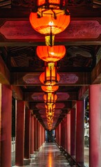 Night view of a corridor decorated with bright red lanterns in Liuzhou, Guangxi, China.