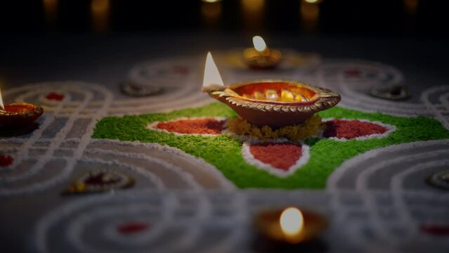 Clay diya lamps lit during diwali celebration, Diwali, or Deepavali, is India's biggest and most important holiday.