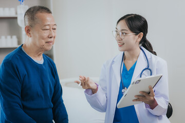 Female doctor talking taking care of her senior patient give support Doctor helping elderly patient...