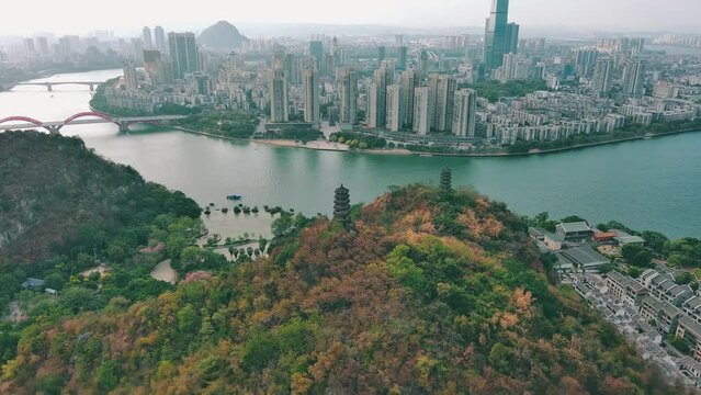 Drone view of a river flowing by the Chongqing cityscape in China