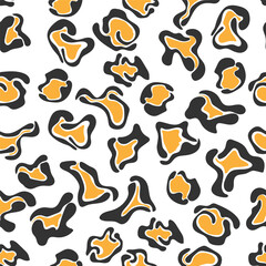 Seamless abstract pattern with black and orange spots of different shapes for textures, textiles and simple backgrounds