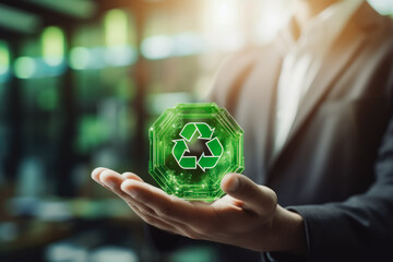 Hand holding the circular ecology economy icon. Clean environment and ecology for green earth concept. Recycling and cleaning up the planet.