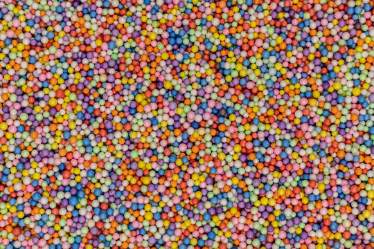 colorful bubble filler. Colorful foam beads shot from above. Backgroound, holiday