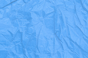 Sheet of crumpled light blue paper