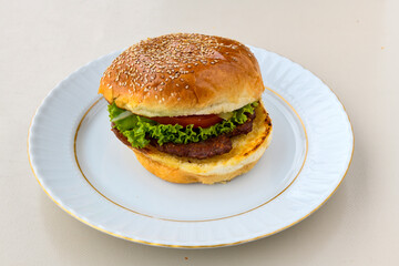 Big tasty burger, hamburger  with beef cutlet on a plate. Crispy chicken burger.