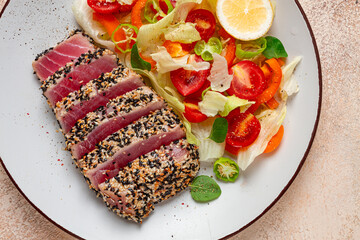 fillet of red tuna meat, fried in sesame seeds, homemade, close-up, no people,