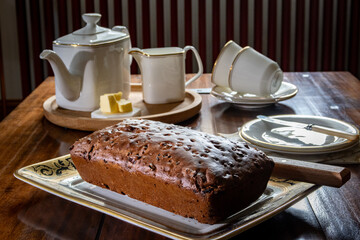 Afternoon tea with home baked tea loaf and white china