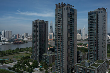 Vietnam, Ho Chi Minh City Skyline panorama on sunny clear day featuring modern architecture and Saigon River