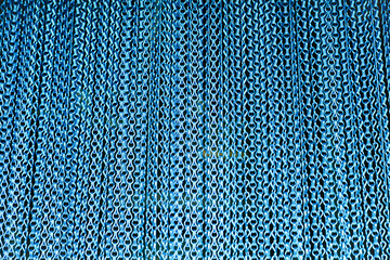 Blue metal chain curtain close-up