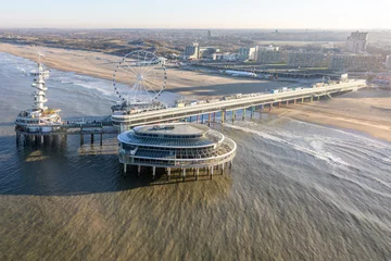 Gardinen Aerial view Dutch pier Scheveningen with cityschape at The Hague © Kruwt