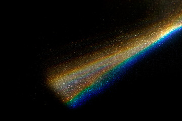 Rainbow light effect from sun flares on black background, colorful glare and shine, light rays on...