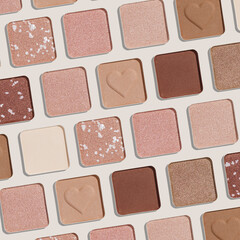 Trend pattern with refill eye shadow swatches, beige brown natural colors on light background. Eyeshadows powder for make up, shiny and matte, minimal aesthetic photo, pastel color, view, flat lay