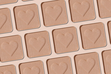 Minimal pattern eye shadow neutral beige swatches with shadow, monochrome photo, eyeshadow with heart imprint, skin colored powder for makeup, square shape metal pack, beauty cosmetic texture