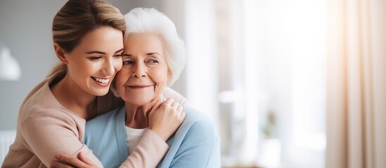 Nurse hugging elderly patients during visit at home