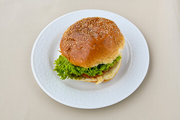 Big tasty burger with beef cutlet on a plate. Hamburger. Crispy chicken burger.