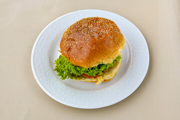 Big tasty burger with beef cutlet on a plate. Hamburger. Crispy chicken burger.