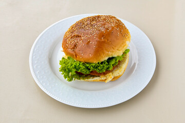 Big tasty burger with beef cutlet on a plate. Crispy chicken burger.