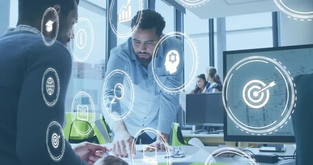 Animation of icon in circles over diverse architects discussing about floor plan on blueprint - Powered by Adobe