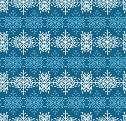 White snowflakes on blue background seamless pattern for Christmas Holidays