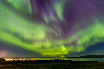 Impressive and breathtaking show of Aurora Borealis or The Northern Lights over the Atlantic Ocean at Western Iceland.