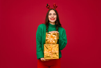 attractive woman celebrating Christmas on red background