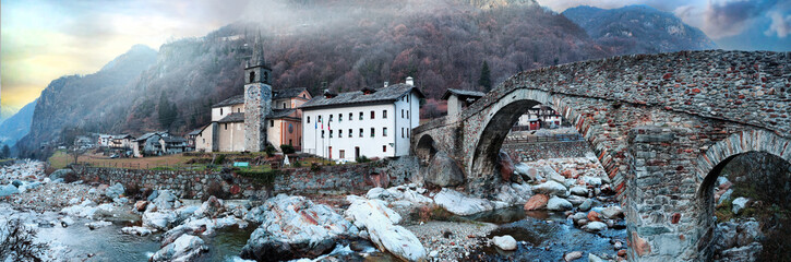 most beautiful Alpine villages of northern Italy- Lillianes medieval borgo with ancient bridge  in...