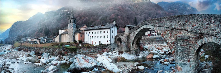 Fototapeten most beautiful Alpine villages of northern Italy- Lillianes medieval borgo with ancient bridge  in Valle d'Aosta region © Freesurf