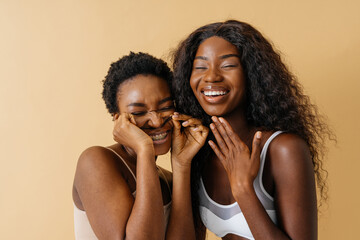Beautiful black women posing in studio wearing lingerie and having fun