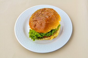Big tasty burger with beef cutlet on a plate. Hamburger. Crispy chicken burger.