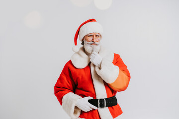 Fototapeta na wymiar Funny Santa Claus with white beard - Santa Claus portrait with festive costume, Christmas and new year festive days concepts