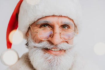 Funny Santa Claus with white beard - Santa Claus portrait with festive costume, Christmas and new...