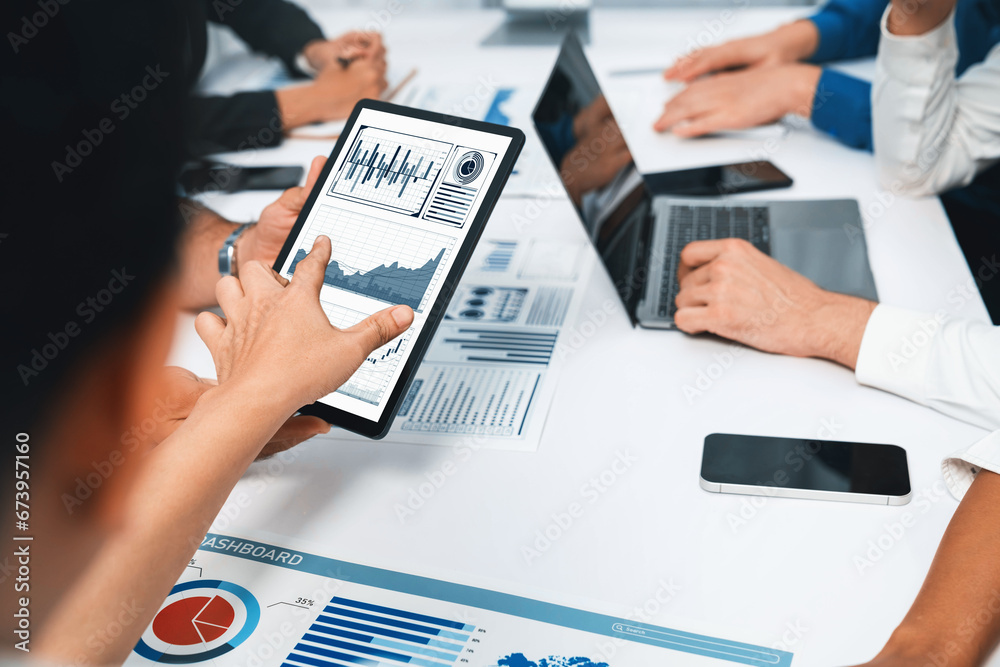 Fototapete analyst team uses bi fintech display tablet to analyze financial data . business people analyze bi s