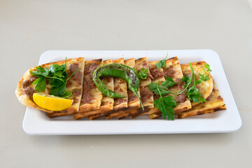 Kiymali pide.Turkish pide with minced meat. Turkish pizza mince pita Pide on white background. Etli ekmek. Kusbasi kasarli, kiymali kasarli, kiymali yumurtali,  tirnak Trabzon, Bafra, Kusbasili pide.