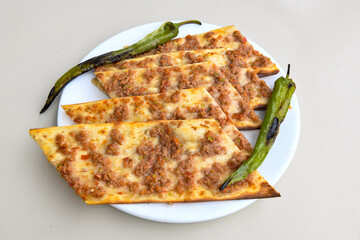 Kiymali pide.Turkish pide with minced meat. Turkish pizza mince pita Pide on white background. Etli ekmek. Kusbasi kasarli, kiymali kasarli, kiymali yumurtali,  tirnak Trabzon, Bafra, Kusbasili pide.