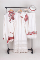 Slavic traditional clothing: women's and men's shirts, hat and apron.