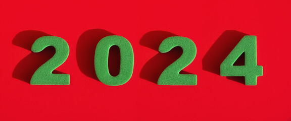 2024 new year. green numbers on a red background. decoration for the new year of the dragon. winter holidays.