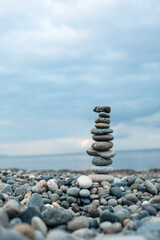 Pebble tower on the beach. Relaxing peaceful spa tranquility concept with copy space for text