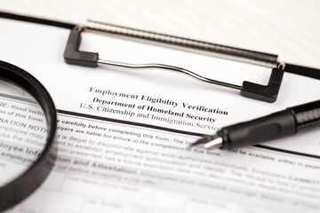 I-9 Employment Eligibility Verification blank form on A4 tablet lies on office table with pen and...