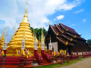 Golden pagoda in teak temple Thailand