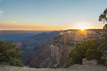 sun setting over the grand canyon