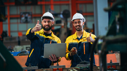 Team engineers and foreman thumb up to show success at factory machines. Worker industry join hand...