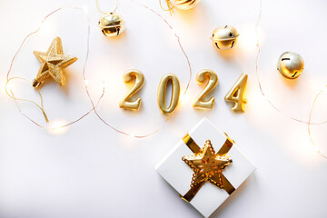 New Year's Eve 2024. Gold Color Christmas Tree Decorations and Gift for Happy New Year Celebration 2024 Golden Banner
