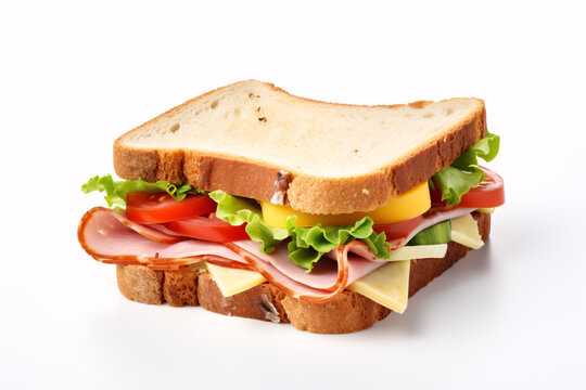 A white-backgrounded ham, cheese and veggie-filled sandwich is pictured.