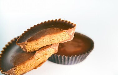 Macro shot of Peanut butter filled candy with chocolate frosting isolated on white background