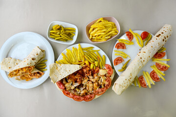 Turkish and Arabic Traditional Ramadan doner kebab with tasty tomato sauce and rice or turkish...