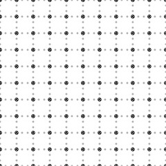 Fototapeta na wymiar Square seamless background pattern from black roundabout signs are different sizes and opacity. The pattern is evenly filled. Vector illustration on white background