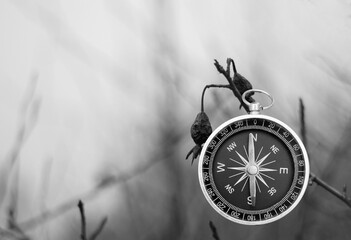 black and white photo of round compass - 674022193