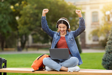 Young indian woman student have online class, celebrating success