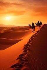 Fototapeta na wymiar caravan of camels cross the sahara desert between the sand and dunes at sunset