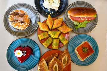 Table scene of assorted take out or delivery foods. Traditional Turkish cuisine. Various Turkish meal and appetizers. Top down view on a table.